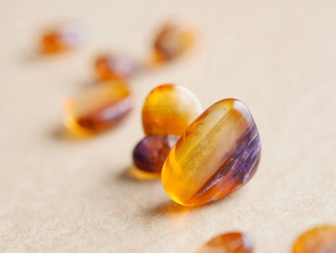 Soft abstract shapes representing scattered fatigue indicators across the body and mind